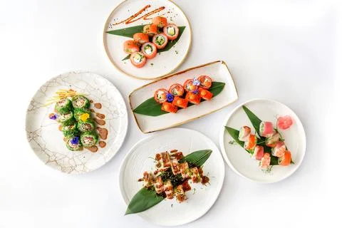 Top view of assorted sushi. Rainbow sushi roll, uramaki Stock Photos