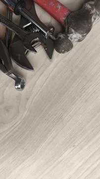 Top view of assorted tools over wooden panel with room for headline text. I.. Stock Photos