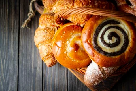 Top view of assortment of different cereal bakery: bread, pasties, buns, pretzel Stock Photos