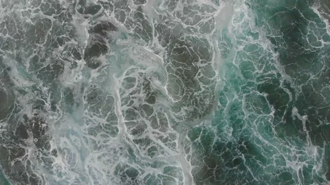 Top view of the Atlantic Ocean in front of the beach. A big wave is rolling. Stock Footage 135149751