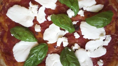 Top view of an authentic Italian pizza with fresh mozzarella cheese and basil on Stock Footage 155995854