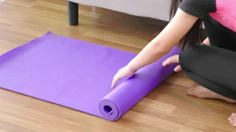 Top view of B roll shot of woman roll out yoga mat for preparation. Close up  Stock-Footage 168251219