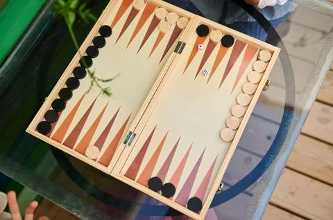 Top view of a backgammon game in progress on a glass table Stock Photos