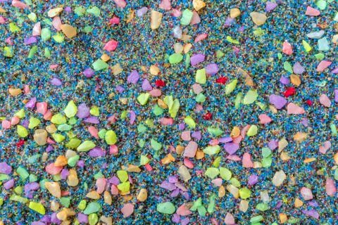 Top view with background of multi-colored small pebbles. Multi-colored pebble Foto stock