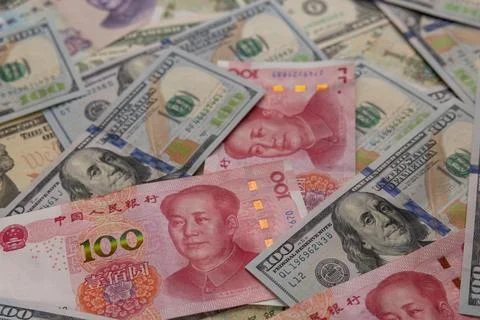 Top view background of scattered Chinese yuan RMB and US dollar banknotes m.. Stock Photos