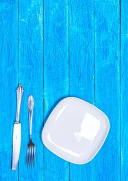 Top view background with squared empty white ceramic plate, antique silver Stock Photos