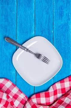 Top view background with squared empty white ceramic plate, antique silver Stock Photos