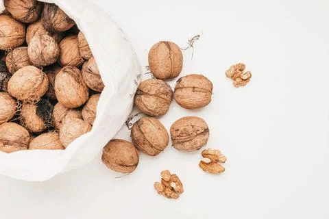 Top view of a bag of walnuts on white background Stock Photos