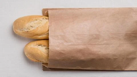 Top view baguettes paper packaging. High quality and resolution beautiful p.. Stock Photos