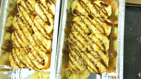 Top view of baked hot sushi with crab cream sauce with sesame seeds and ginger Stock Footage 237520002