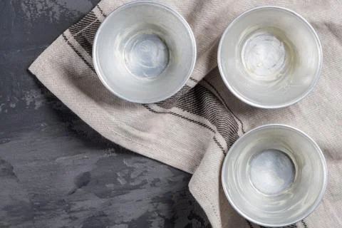 Top view of baking forms smeared with butter. Preparing to bake cupcakes. Stock Photos