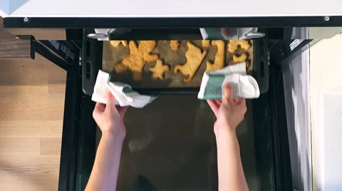 Top view of Baking Gingerbread man in the oven, view from above of the oven. 動画素材 66447105