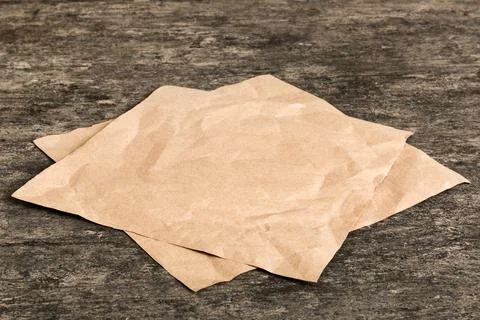 Top view with baking parchment empty on table background. Folded cloth for .. Stock Photos