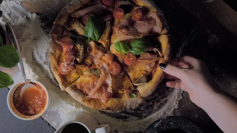Top view of baking a pizza with hands taking slices and empty the plate Stock Footage 97089656