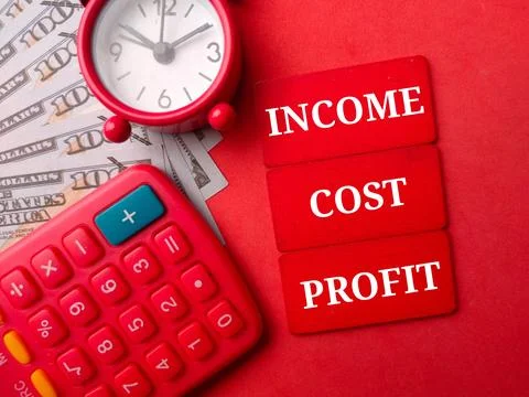 Top view banknote and calculator with the word INCOME COST PROFIT Stock Photos