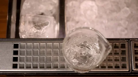 Top view, barman puts ice in a glass Stock Footage 75708009