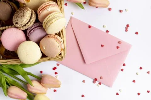 Top view basket macarons envelope valentines day Stock Photos