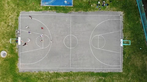 Top view at a basketball match between Amateur teams outdoors Stock Footage 123843633