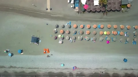 Top view of the beach and sun beds. The deserted coast of the Sea, Spain Stock Footage 130313819