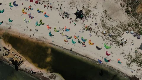 Top view on the beach full of people and kites for kitesurfing, summer, 4k Stock Footage 144827411