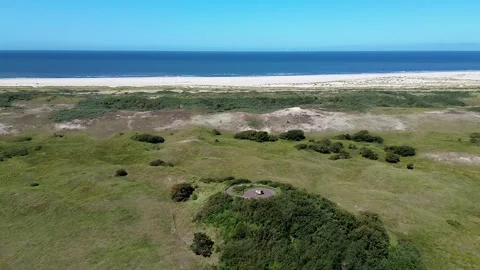 Top view of the beach kijkduin and sea. Flight over fields with green grass Stock Footage 252262425