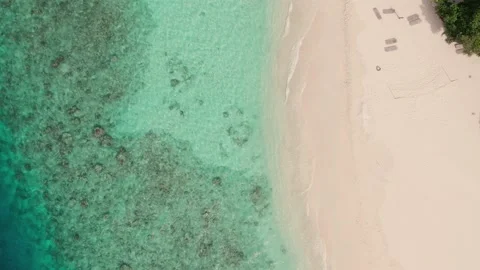 Top view of beach in Maldives, clear water and coastline shot from above 動画素材 166795722