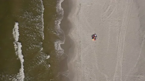 Top View Of A Beach Parasol Along Sandy Shore Of Baltic Sea. Aerial Stock Footage 165801066