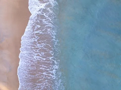 Top view beach with waves crashing on sandy shore,Beautiful waves sea surfa.. Stock Photos