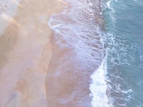Top view beach with waves crashing on sandy shore,Beautiful waves sea surfa.. Stock Photos