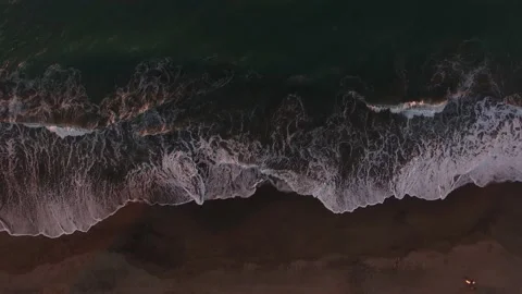 TOP VIEW OF BEACH WITH WAVES SUNSET Stock Footage