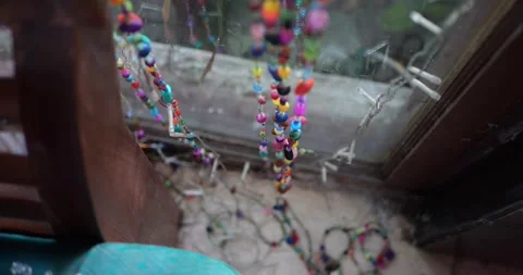 A Top View of a Beaded Window Decoration in a Cafe Setting. Stockbeeldmateriaal 286433604