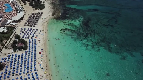 Top view of a beautiful beach with clear turquoise water near the shore Stock-Footage 122503662