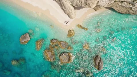 Top view of beautiful beach with rocks and turquoise sea. Stock Footage 156629541