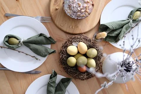 Top view of beautiful Easter table with pastries, willow branches, eggs and Stock Photos