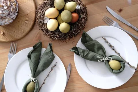Top view of beautiful Easter table with pastries, willow branches, eggs and Stock Photos