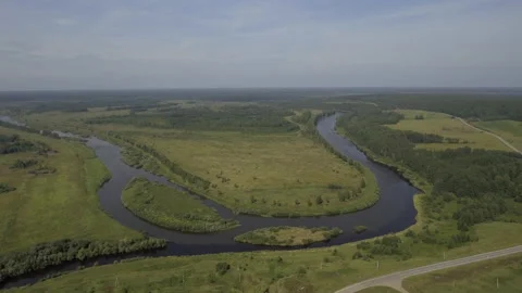 Top view of beautiful river turns on bac... | Stock Video | Pond5