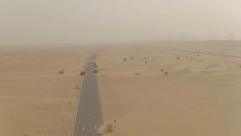 Top view of the beautiful road and race car in the desert in the Emirates Stock Footage 100969753