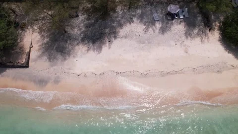 Top view of beautiful sand beach with azure seawater, wave passes, aerial shot Stock Footage 256219576