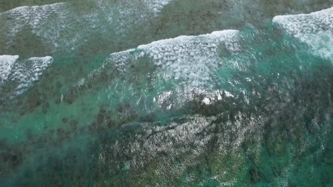 Top view of beautiful sand beach with azure seawater, wave passes, aerial shot Stock Footage 256456417