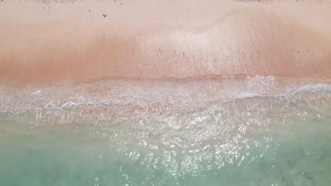 Top view of beautiful sand beach with azure seawater, wave passes, aerial shot Stock Footage 260196410