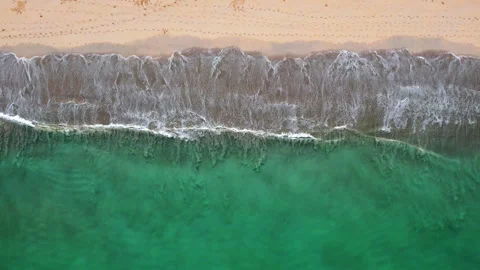 Top view of beautiful sand beach with emerald waves and golden sand, aerial shot Stock Footage 294729100