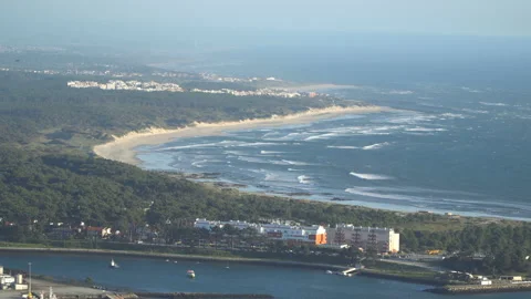 Top view of a beautiful sandy beach with the blue waves rolling into the shore Stock-Footage 91245898