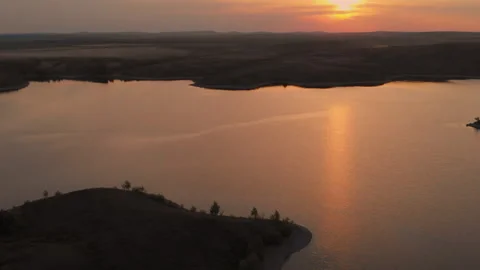 Top view of a beautiful sunset in an open field. Beautiful nature, flying a Stock Footage 145924226