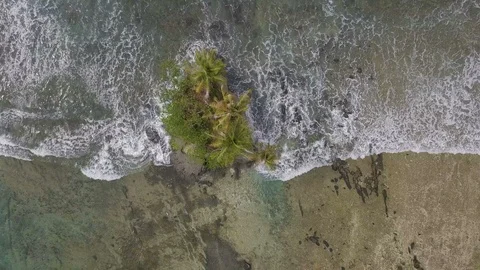 Top view of beautiful tiny island in the middle of the sea surface Stock Footage 113745834