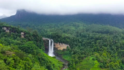 Top view of Beautiful waterfall in green forest. Stock Footage 220048626