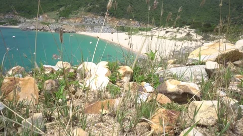 Top view on beautiful wild beach lagoon between mountains. Stock Footage 75940844