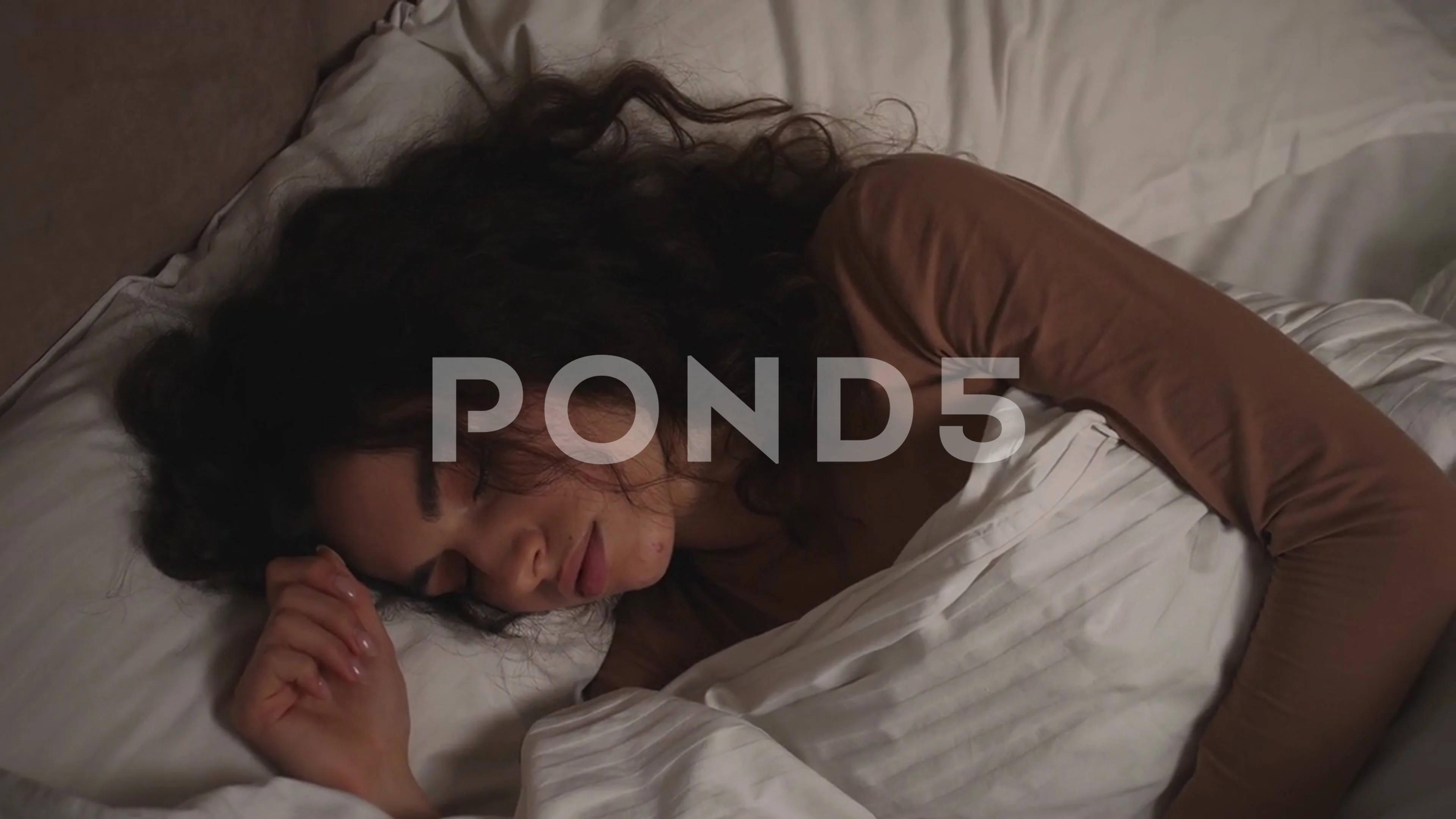 Young Woman sleeping in bed at night, Stock Video