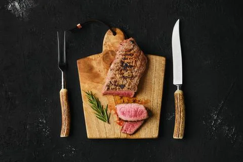 Top view of beef steak medium rare with slices Stock Photos