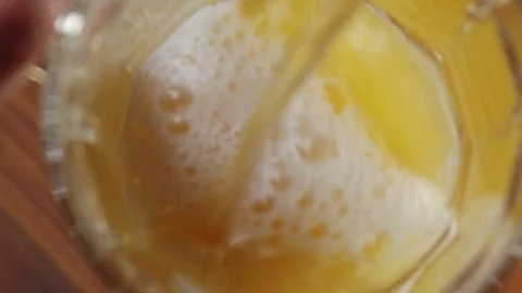 Top View of Beer Pouring Into a Glass. Beautiful background of the Oktoberfest Video stock 80451992