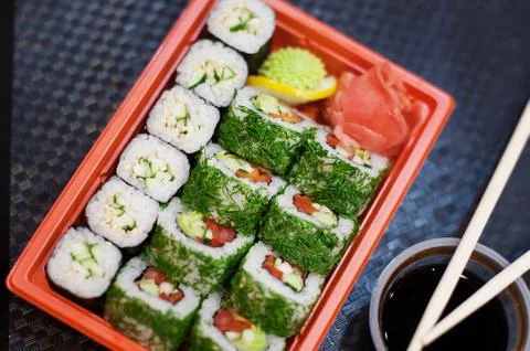 Top view of bento to-go plastic box, mixed nigiri and assorted sushi roll in Stock Photos